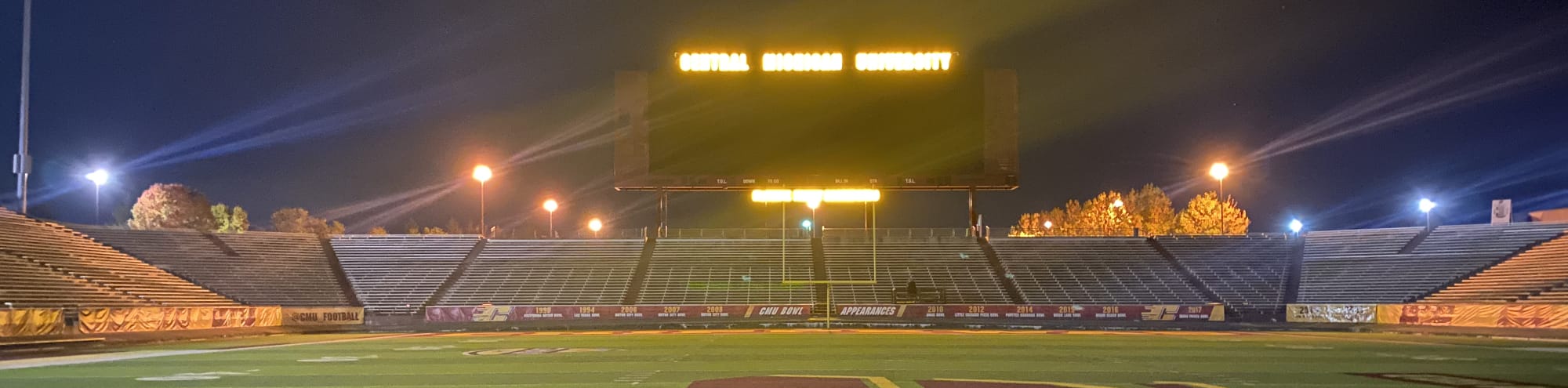 empty football stadium at night under the lights Fresno